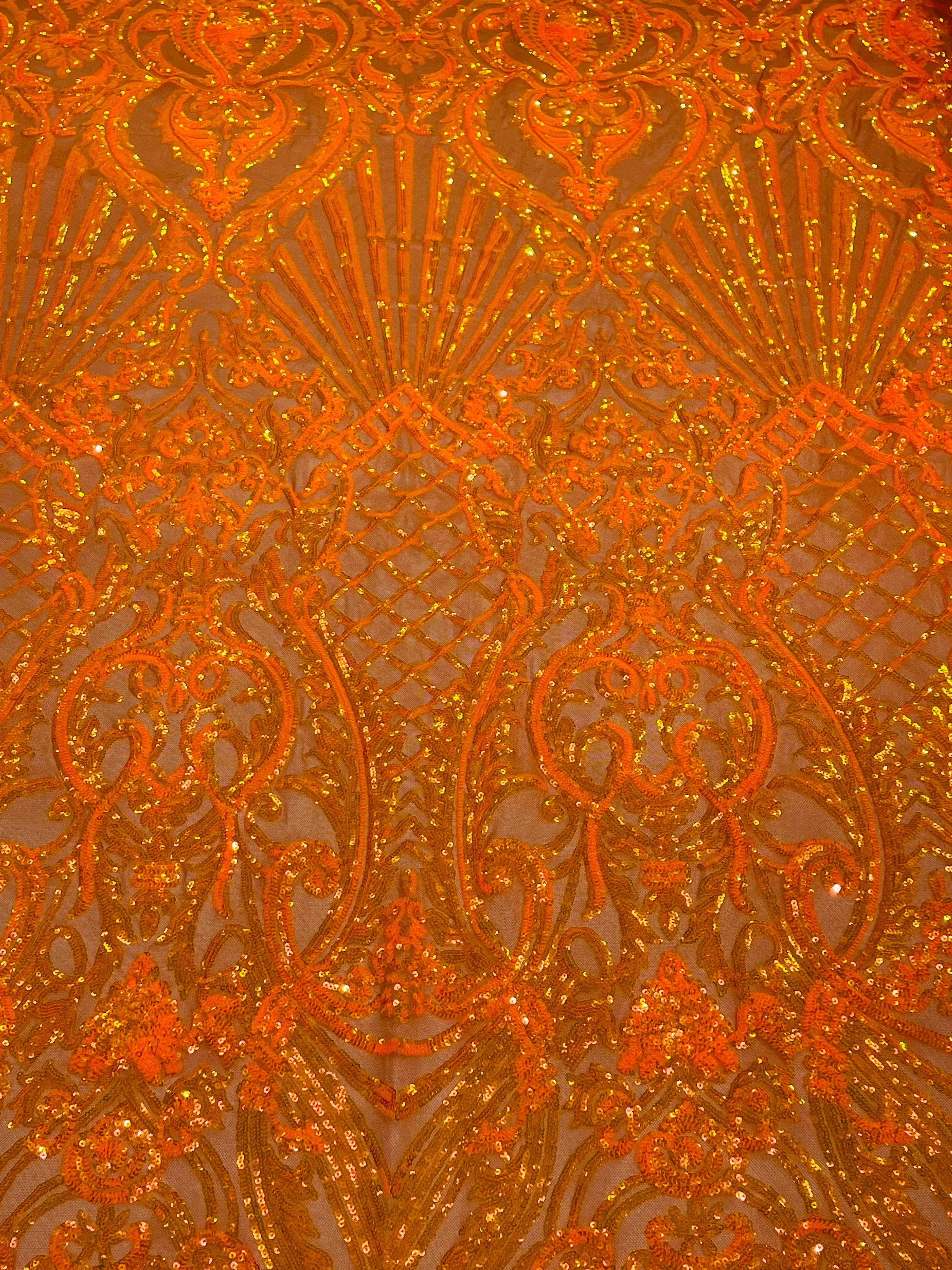 Orange iridescent sequin damask design on a 4 way stretch mesh- sold by the yard.