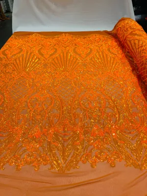 Orange iridescent sequin damask design on a 4 way stretch mesh- sold by the yard.