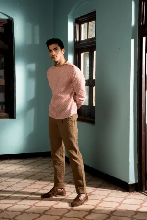 Salmon tunic with dark beige trousers